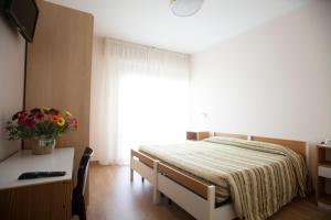 Postel nebo postele na pokoji v ubytování Hotel Cecco