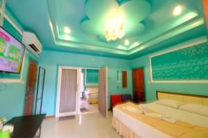 Кровать или кровати в номере Rak Kun Resort 2