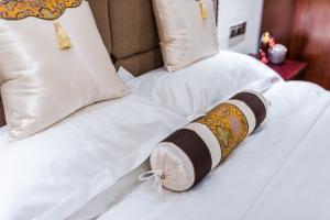 Postel nebo postele na pokoji v ubytování Hainan Jingshan Hotel