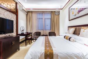 TV a/nebo společenská místnost v ubytování Hainan Jingshan Hotel