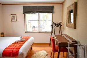 Letto o letti in una camera di Mojo Lodge Hakuba
