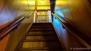 a staircase leading up to a stair case at Peace house Abeno in Osaka