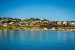
a large body of water with houses at Pacific Pines Unit 6 in Narooma
