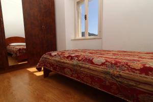 Ένα ή περισσότερα κρεβάτια σε δωμάτιο στο Apartment Lepur Slano
