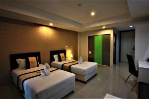 Postel nebo postele na pokoji v ubytování Retreat Resort Pattaya