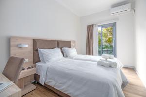 Postel nebo postele na pokoji v ubytování Attalos Hotel + 37 fotografií