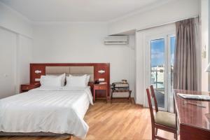 Postel nebo postele na pokoji v ubytování Attalos Hotel