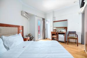 Postel nebo postele na pokoji v ubytování Attalos Hotel