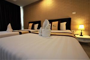 Postel nebo postele na pokoji v ubytování Retreat Resort Pattaya