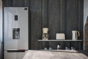 Příslušenství pro přípravu čaje a kávy v ubytování Apartment Maris