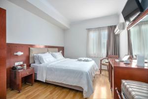 Postel nebo postele na pokoji v ubytování Attalos Hotel