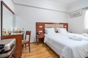 Postel nebo postele na pokoji v ubytování Attalos Hotel