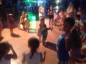 a group of children standing around in a crowd at Lyda Hotel in Gouves