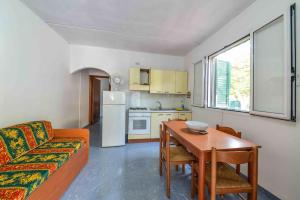 a living room with a couch and a table at Residence Dattoli in Peschici +9 photos