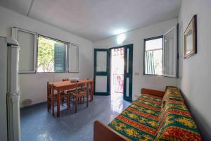 a bedroom with a bed and a table in it at Residence Dattoli in Peschici