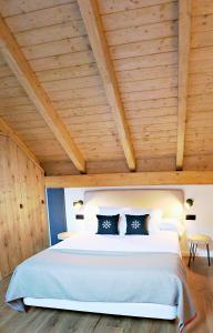 Postel nebo postele na pokoji v ubytování Hotel Lo Paller