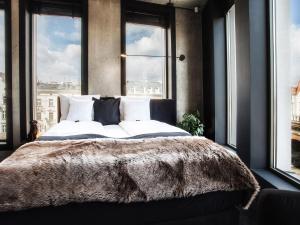 Łóżko lub łóżka w pokoju w obiekcie The Loft All-Inclusive Hotel Adults Only