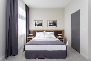 Posteľ alebo postele v izbe v ubytovaní Jakubowy Hotel