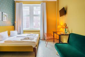 Postel nebo postele na pokoji v ubytování Hotel BELLEVUE am Kurfürstendamm