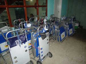 a row of blue and white carts in a room at Pousada Clariô in Bertioga
