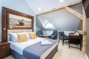 Posteľ alebo postele v izbe v ubytovaní Jakubowy Hotel