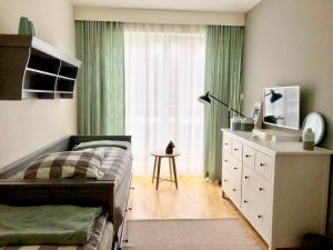 Telewizja i/lub zestaw kina domowego w obiekcie Blue Sea Apartment