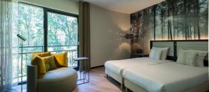 Postel nebo postele na pokoji v ubytování Fletcher Hotel-Restaurant Jagershorst-Eindhoven