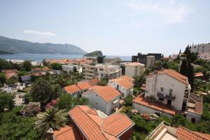 an aerial view of a city with buildings and the ocean at The Old Town Terrace Apartments in Budva