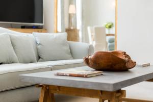 a living room with a couch and a coffee table at Queens Circus - Montpellier, Central Cheltenham in Cheltenham