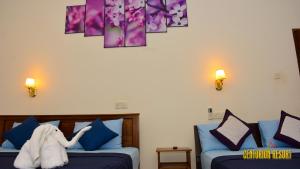Postel nebo postele na pokoji v ubytování Centurion Resort