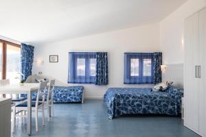 Postel nebo postele na pokoji v ubytování Hotel La Playa