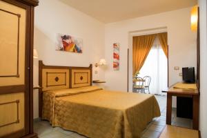 Postel nebo postele na pokoji v ubytování Hotel La Playa