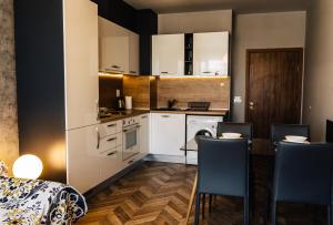 Kuchyň nebo kuchyňský kout v ubytování Apartment K
