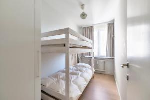 a bedroom with two bunk beds and a window at Sea View in Ostend