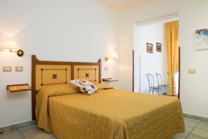 Postel nebo postele na pokoji v ubytování Hotel La Playa