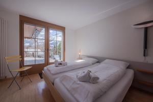 Postel nebo postele na pokoji v ubytování Chalet Alpenrebe