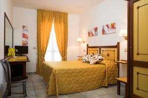 Postel nebo postele na pokoji v ubytování Hotel La Playa