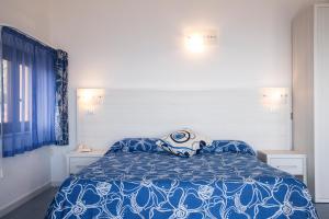 Postel nebo postele na pokoji v ubytování Hotel La Playa