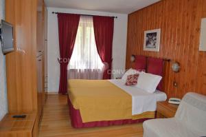 Una cama o camas en una habitación de Albergo Sella - Monte Amiata