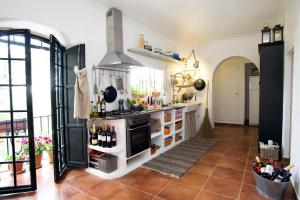 a kitchen with a stove and a counter at Casa MariSol in Arcos de la Frontera