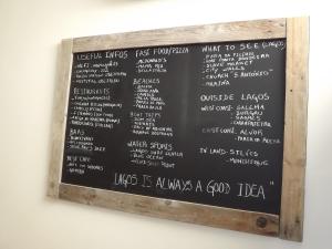 a chalkboard menu board for a fast food restaurant at Hotel Mar Azul in Lagos