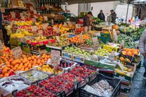 a market with many different fruits and vegetables on display at IL FIORE D'ORO LUXURY in Naples