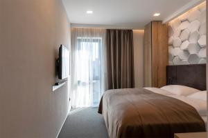Letto o letti in una camera di 4 SMART HOTEL
