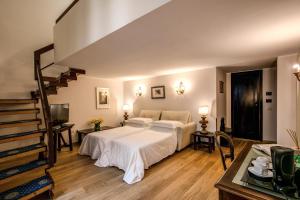 Postel nebo postele na pokoji v ubytování Hotel Croce Di Malta