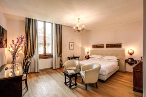 Postel nebo postele na pokoji v ubytování Hotel Croce Di Malta