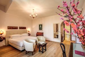 Postel nebo postele na pokoji v ubytování Hotel Croce Di Malta