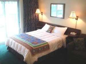 Ένα ή περισσότερα κρεβάτια σε δωμάτιο στο Motel Tyrol