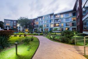 a walkway in front of a building at Accra Fine Suites - The Pearl In City in Accra