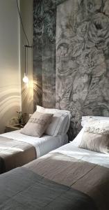 Vittorio Veneto 25 tesisinde bir odada yatak veya yataklar
