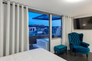 Posteľ alebo postele v izbe v ubytovaní Athenian Lofts